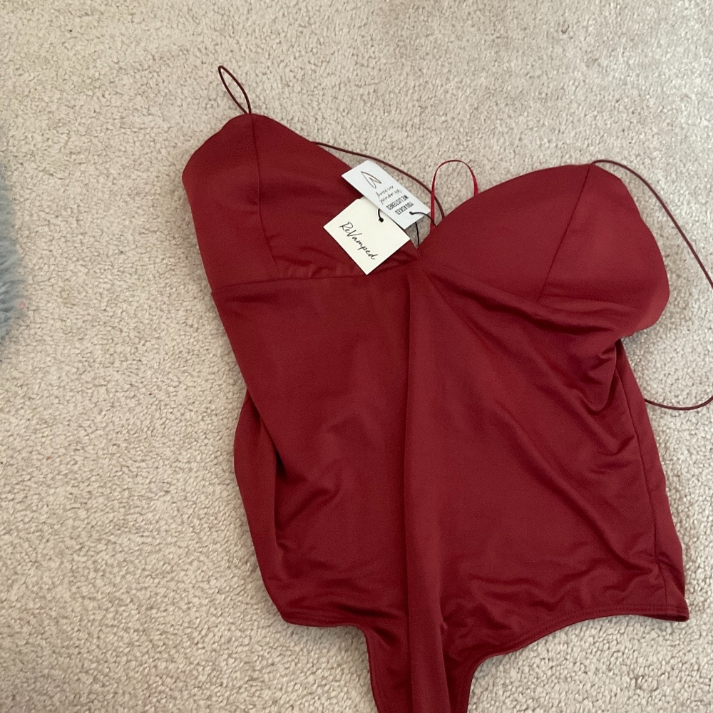 I am selling a women red body suit!